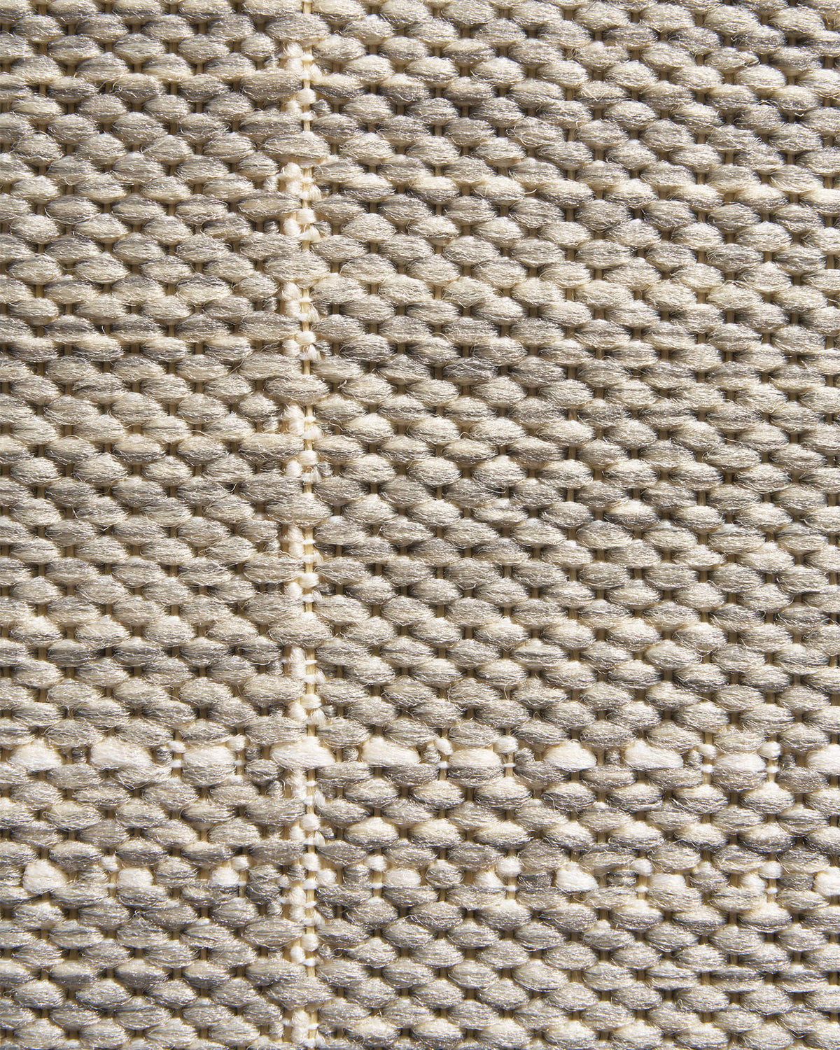 A macro close-up of a light gray subtle grid outdoor rug highlights its raised woven check texture, durable thread construction, and clean natural style for patios, decks, porches, and outdoor living spaces.