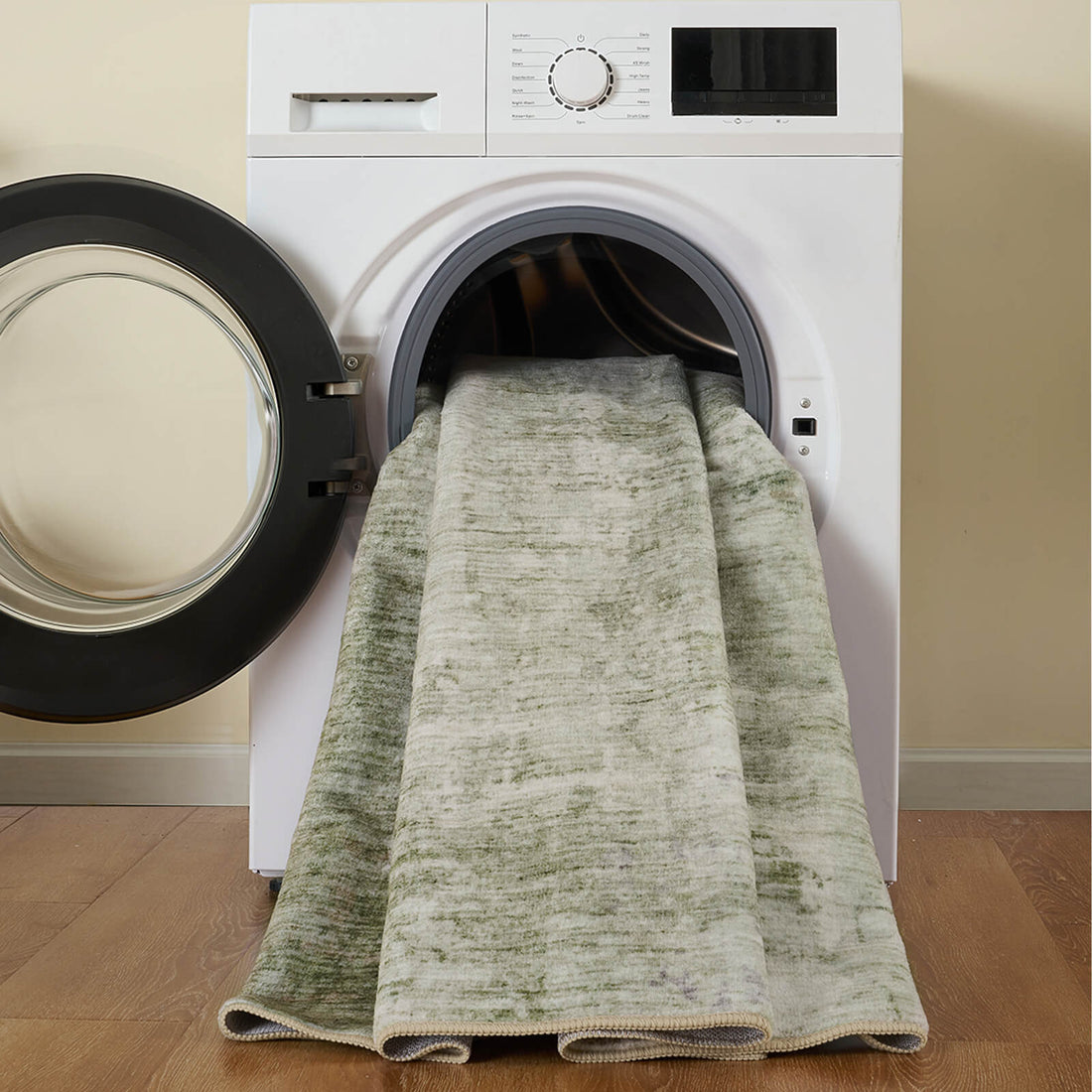 A machine washable green area rug with a soft modern low-pile design makes everyday cleaning easier for busy homes with kids, pets, and high-traffic spaces.