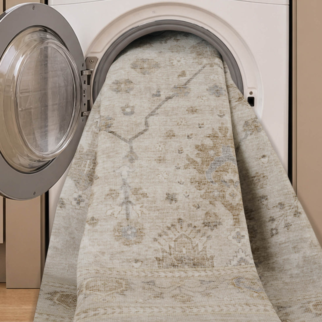 A neutral vintage washable area rug is shown in a washing machine, highlighting its machine washable design, soft low-pile texture, distressed medallion pattern, and easy-clean convenience for busy homes.