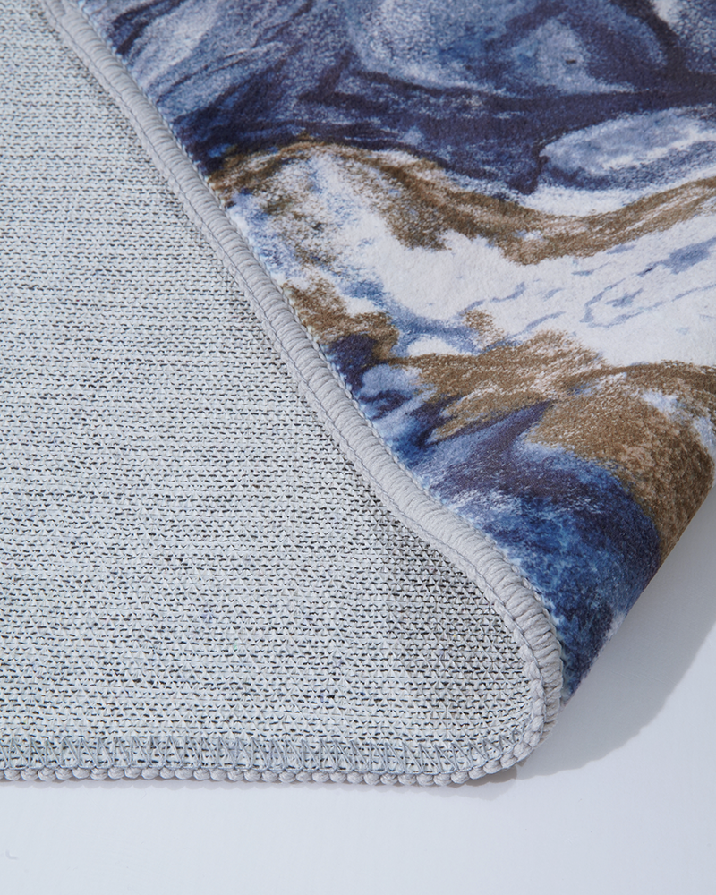 Modern area rug designed to soften hard surface floors with gentle comfort.