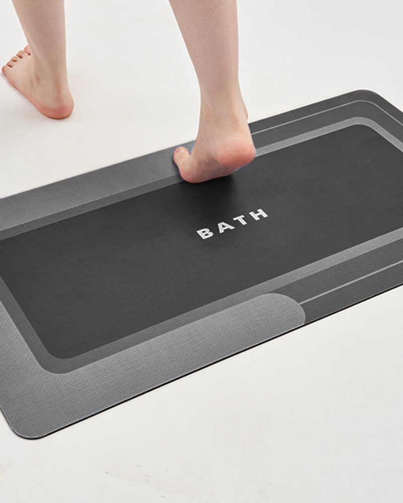 Quick-dry, absorbent bath mat with non-slip backing, designed for bathroom use.