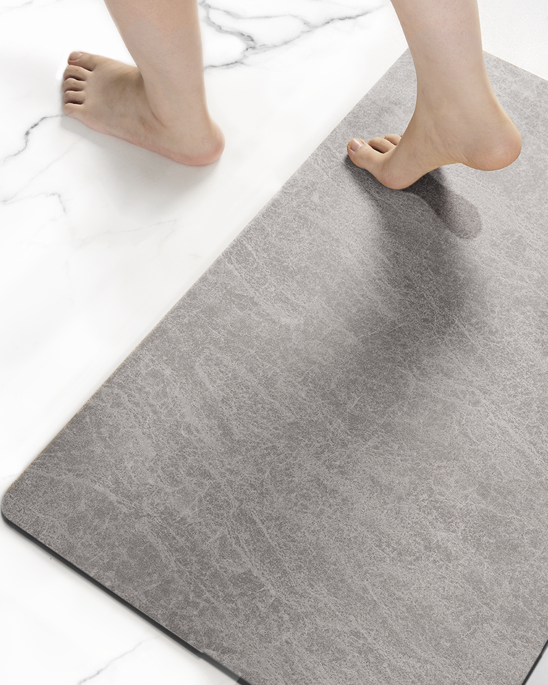 Non slip bathroom mat with rubber backing that stays flat on wet floors, ideal for homes with kids, pets, and elderly family members
