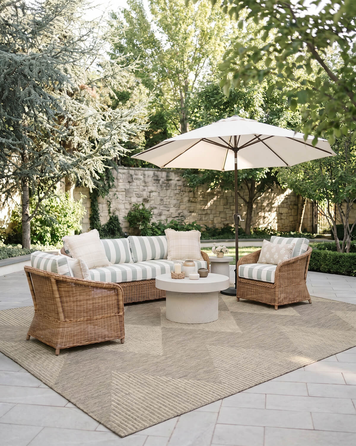 This outdoor rug adds a clean and welcoming foundation to a patio seating area with a durable easy-clean surface made for relaxed everyday outdoor living.