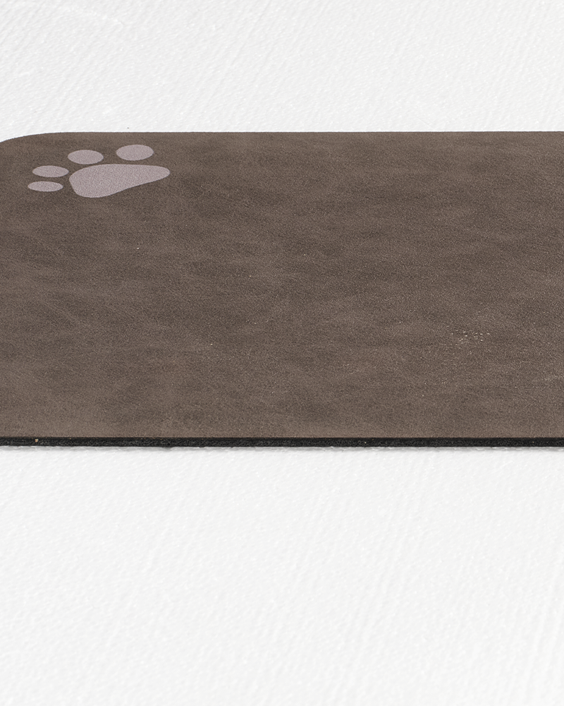 Non-slip waterproof pet feeding mat with quick drying top, durable and pet safe.