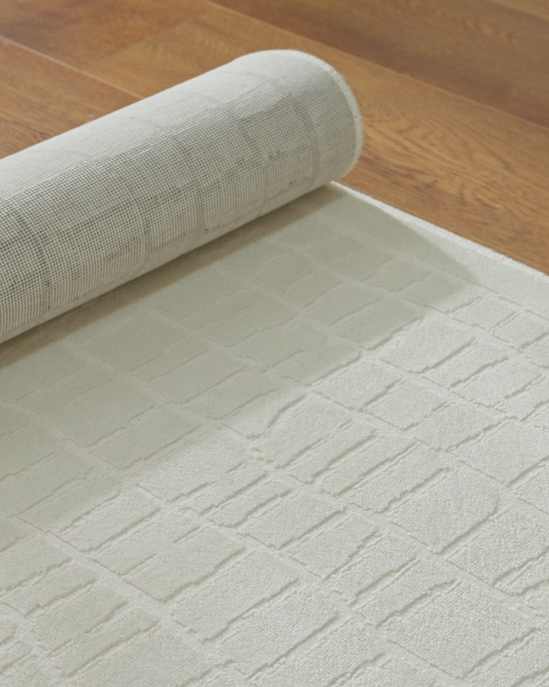A premium Wilton jacquard rug detail video shows its plush textured surface, structured woven backing, and elevated design quality for luxurious everyday home styling.