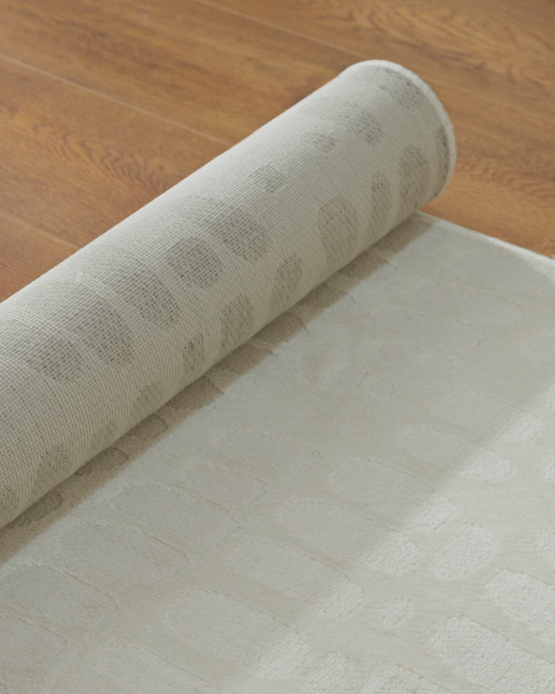 Load video: A detail video of a premium jacquard area rug highlights its raised woven texture, dimensional pattern, and refined surface finish for luxury living room and bedroom decor.