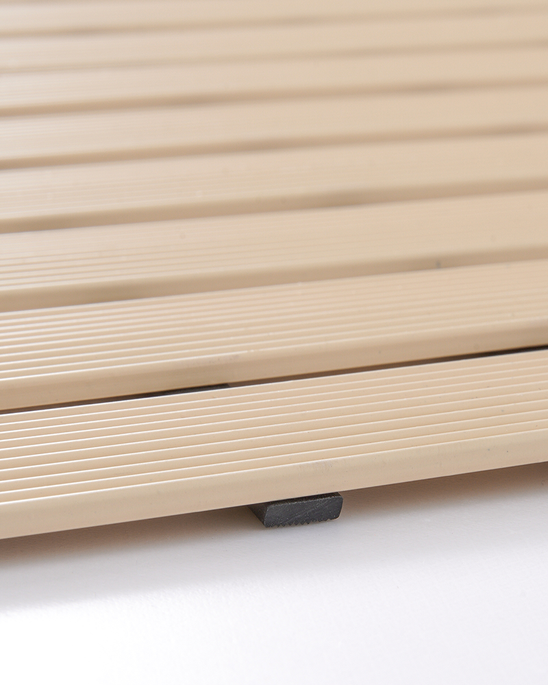 Rubber shower mat designed for poolside and outdoor showers