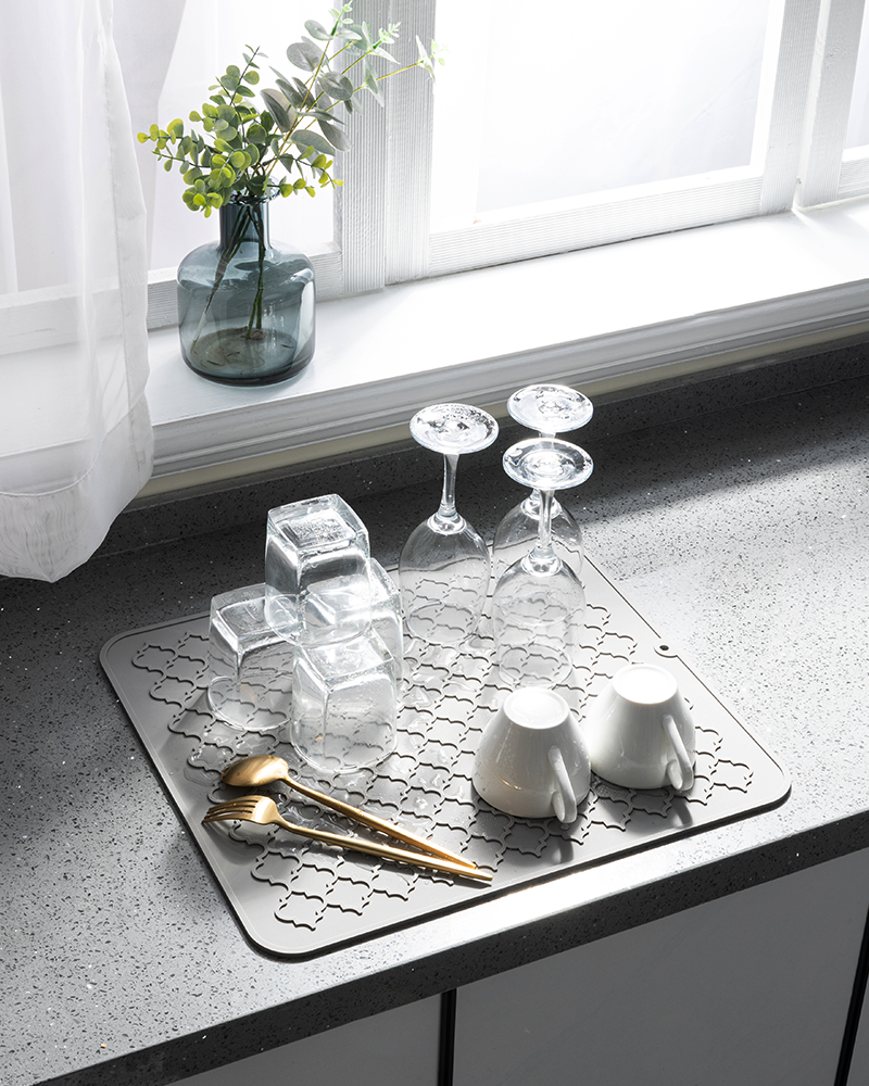 Minimalist silicone dish mat that complements a modern, organized kitchen look.