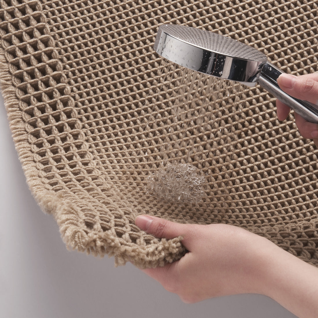 Soft bath mat with non slip backing designed for everyday bathroom use and comfort
