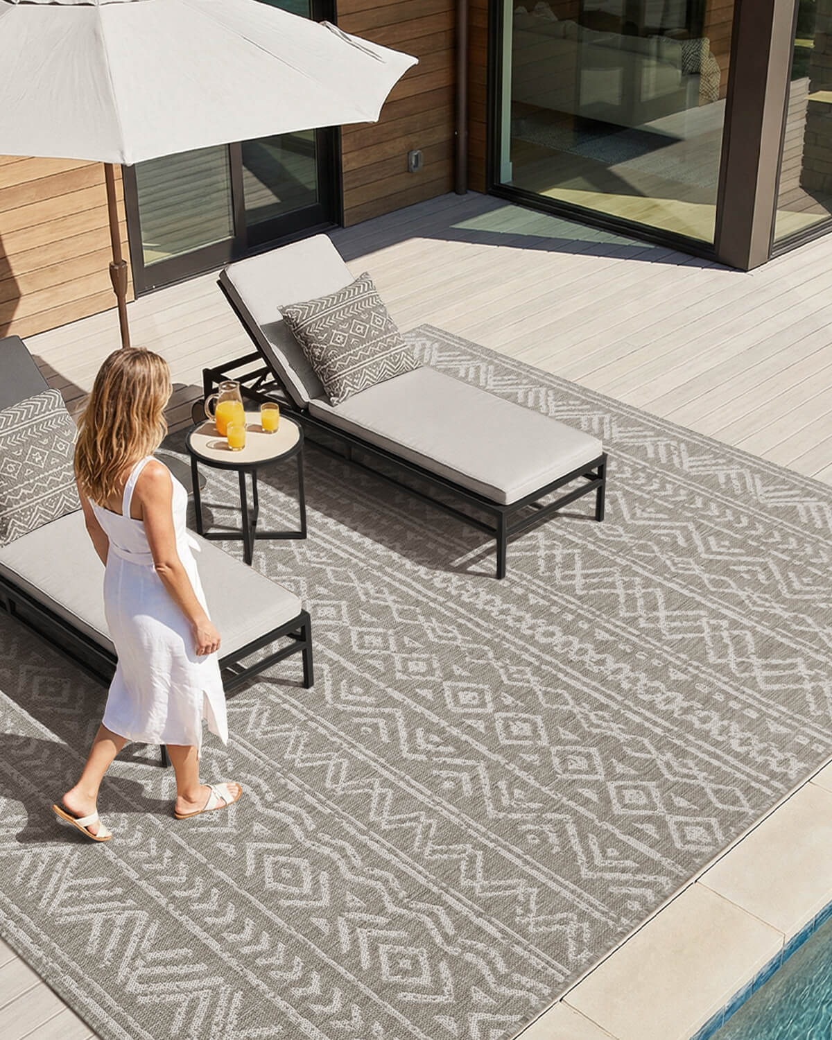 Indoor outdoor rug combining soft comfort with weather resistant durability for patios balconies and living spaces