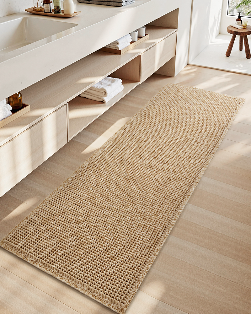 Polyester waffle bath mat, super absorbent, non-slip, and durable for everyday use.