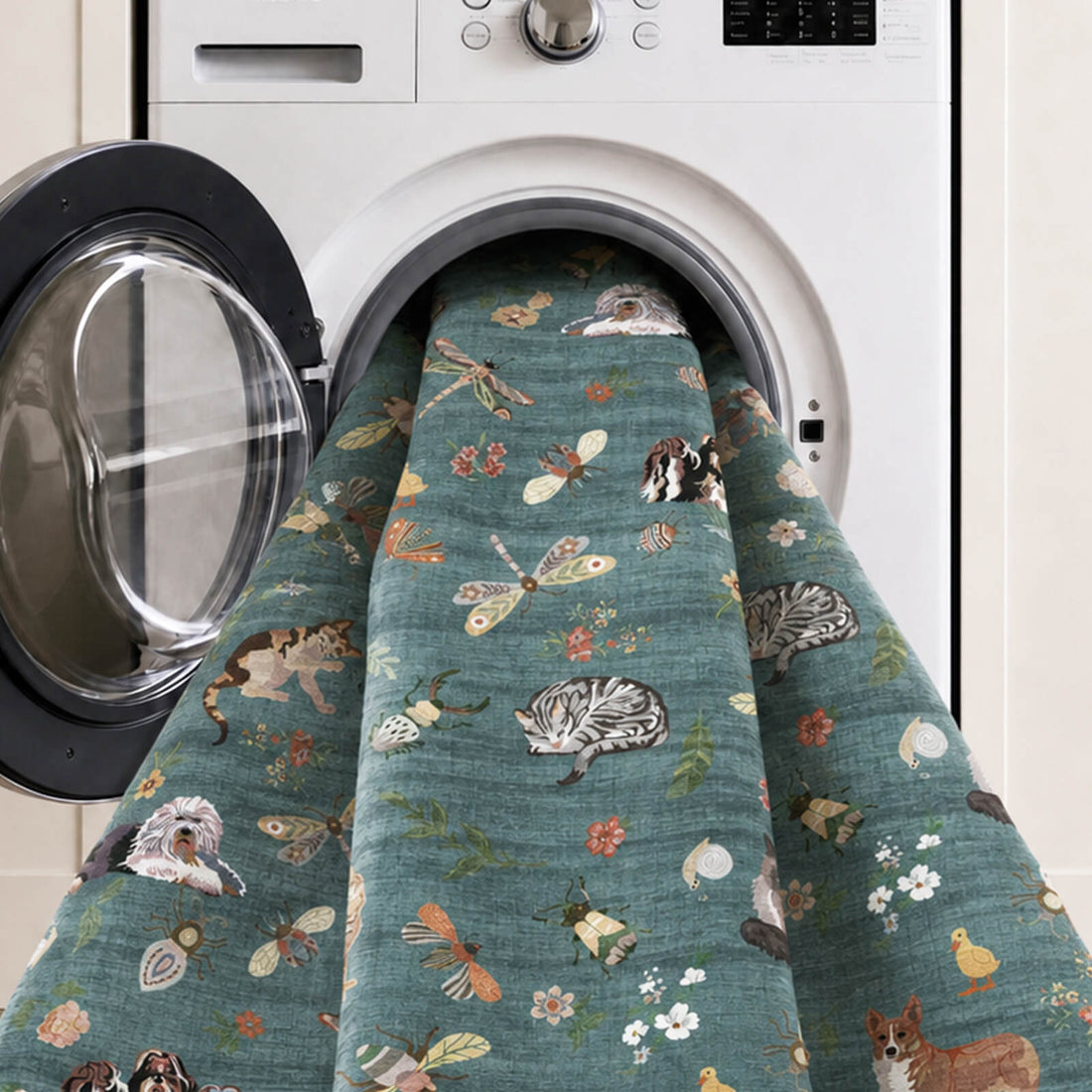 A teal soft kids rug is shown in a washing machine, featuring cute animal, butterfly, and floral illustrations with a gentle comfortable surface and easy-care design for nurseries, playrooms, and children’s bedrooms.