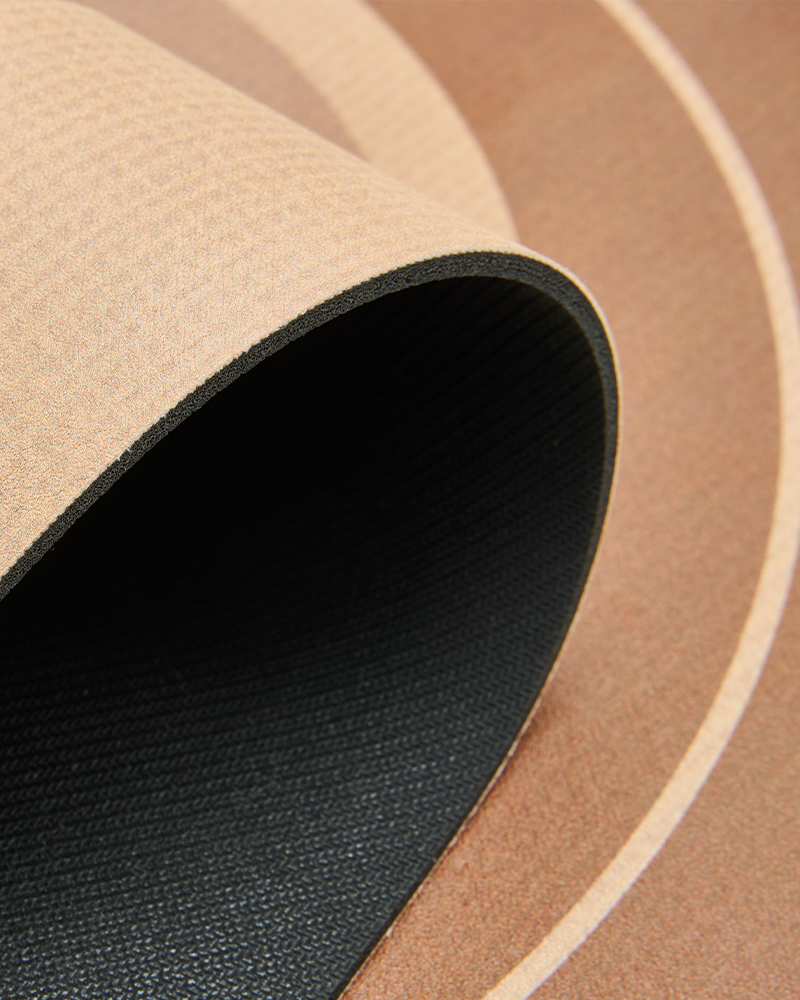 Ultra thin round bath mat that fits easily under doors, staying flat without curling or creasing