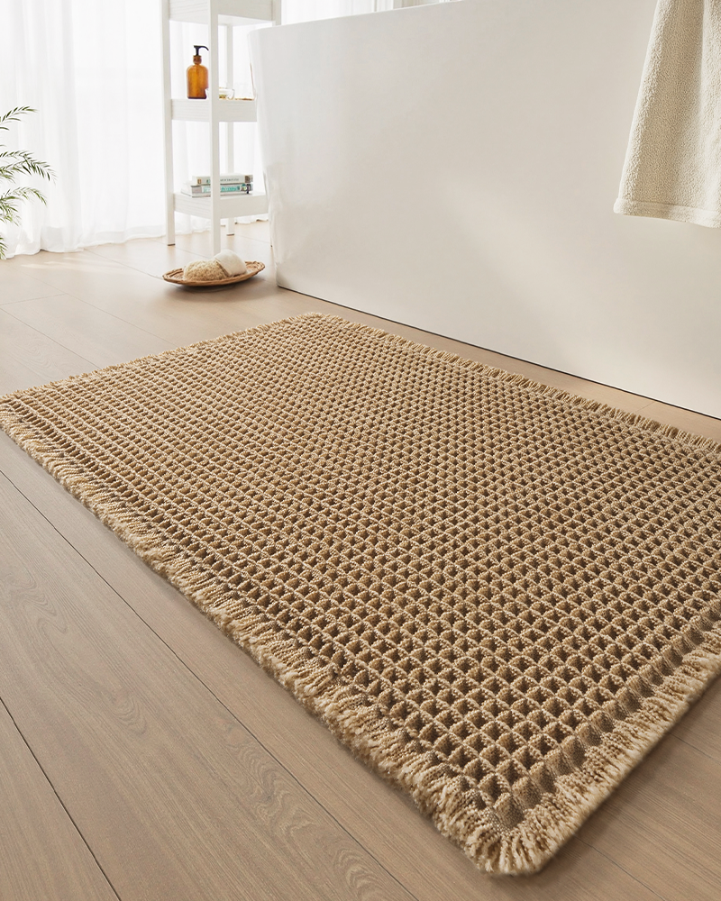 Non-slip waffle bath mat designed for bathroom floors and beside the bathtub.