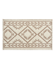 Waffle textured bath mat designed to absorb moisture quickly after showers