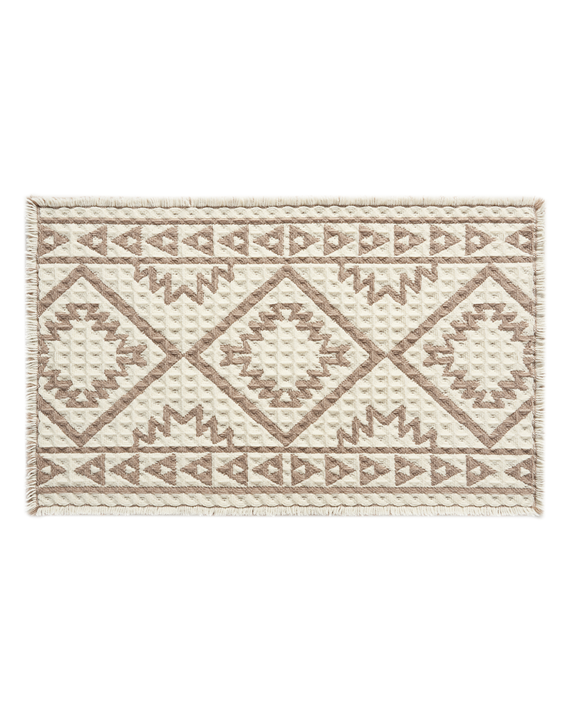 Waffle textured bath mat designed to absorb moisture quickly after showers