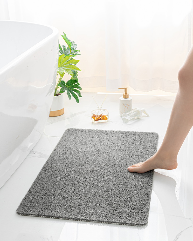 Bath mat that can be rinsed, hung, or laid flat to dry