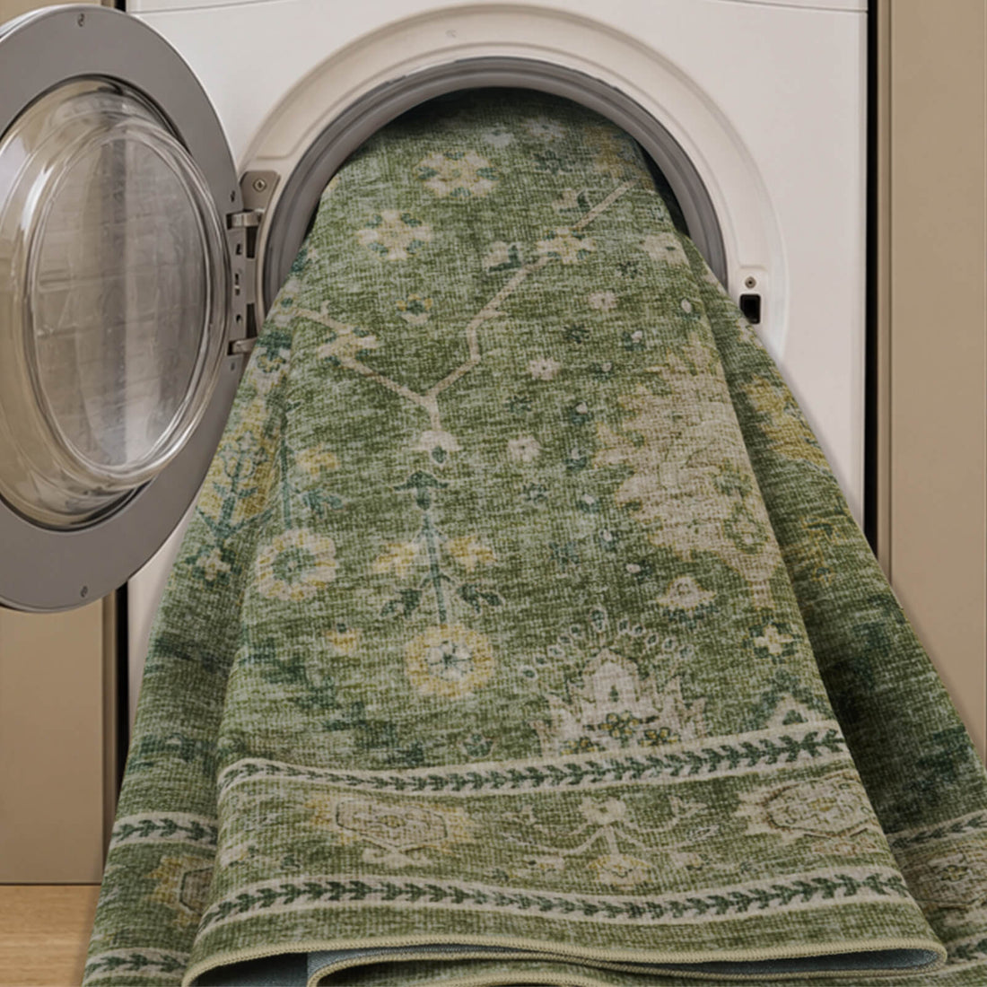 A washable green vintage floral area rug is shown in a washing machine, highlighting its machine washable design, soft low-pile texture, distressed botanical pattern, and easy-care convenience for busy homes.