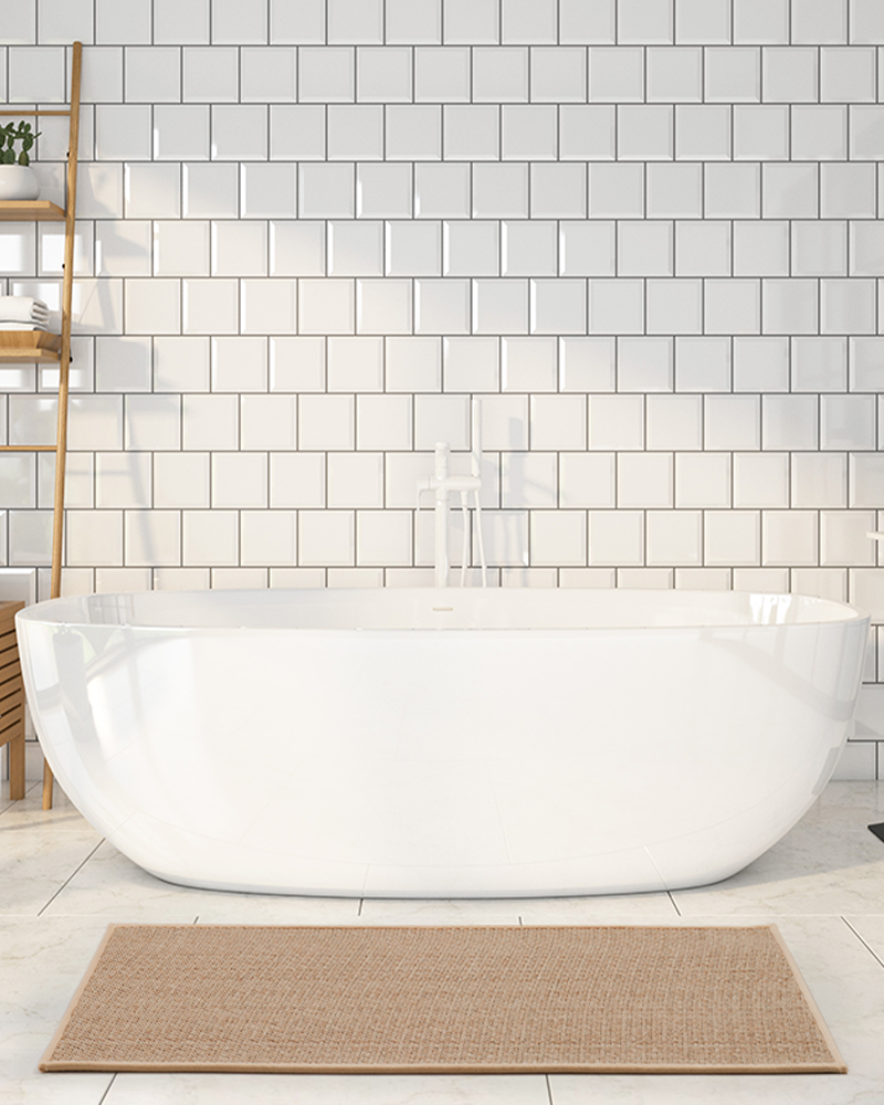 Woven braided bath mat that adds cozy texture while absorbing moisture after showers